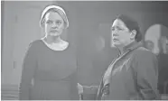  ?? HULU VIA AP ?? Elisabeth Moss, left, and Ann Dowd appear in a scene from “The Handmaid’s Tale.” The program was nominated for an Emmy for outstandin­g drama