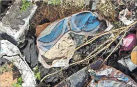  ??  ?? Detritus: Underwear and condoms lie around the backyard