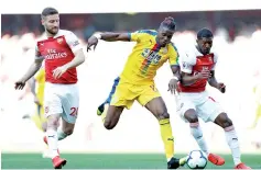  ??  ?? Crystal Palace’s Wilfried Zaha(C) punished sloppy Arsenal. - AFP photo