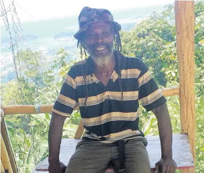  ??  ?? Claude ‘Bobo’ Daley seats at the front of his makeshift shop in Spring Bank,