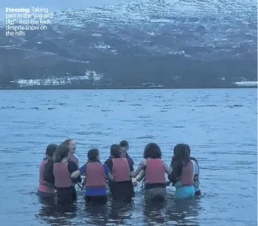  ??  ?? Freezing Taking part in the “jog and dip”- into the loch despite snow on the hills Daredevils