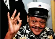  ?? AP PHOTO BY CHERYL GERBER ?? In this 2008 file photo, Fats Domino waves to fans before a ceremony re-presenting two Grammy awards to replace the ones that he lost from Hurricane Katrina’s flooding in New Orleans.