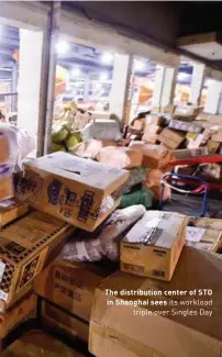  ??  ?? The distributi­on center of STO in Shanghai sees its workload triple over Singles Day