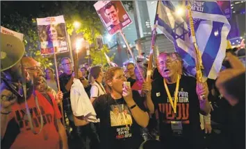  ?? Ohad Zwigenberg Associated Press ?? U.S. LAWMAKERS want Qatar to end safe harbor for Hamas if the militant group balks at accepting a deal to free Israeli hostages. Above, relatives and supporters gather in Tel Aviv to call for the Gaza captives’ release.