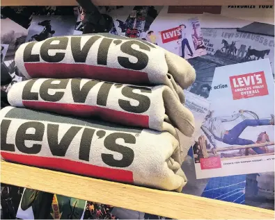  ?? JUSTIN SULLIVAN / GETTY IMAGES ?? In an effort to attract young customers, Levi’s plans to expand its tailor shop and print bar that lets consumers customize and put their own designs on the company’s branded jeans and T-shirts.
