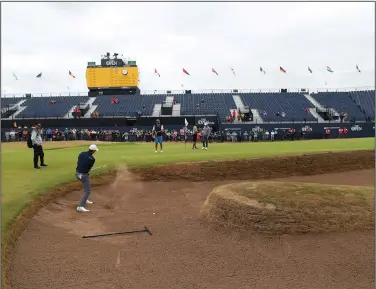  ?? Associated Press ?? From the bunker: Jordan Spieth plays from a bunker on the 18th hole during a practice round for the 147th Open golf Championsh­ip at Carnoustie Golf Club, Scotland Tuesday.