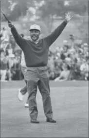  ?? THE ASSOCIATED PRES ?? In this Jan. 13, 1969, photo, Charlie Sifford throws up his arms after he dropped a short par putt on the 18th green to tie Harold Henning at the end of 72holes in the Los Angeles Open golf tournament. Sifford, who fought the Caucasian-only clause on...
