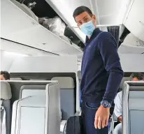  ?? DARKO BANDIC/ASSOCIATED PRESS FILE PHOTO ?? Novak Djokovic prepares to take his seat on a plane Jan. 17 in Dubai, United Arab Emirates. Djokovic said Tuesday he is still not vaccinated, and if that prevents him from competing in the French Open and Wimbledon, it is the price he is willing to pay.