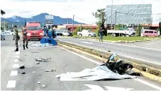  ??  ?? The motorcycle was dragged several meters away after colliding with a truck near Marabahai Spurs junction at Berungis-Tenghilan road in Tuaran.
