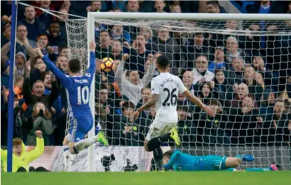  ?? Reuters ?? Chelsea’s Pedro (not pictured) scores their second goal as Swansea City’s Lukasz Fabianski looks on. —