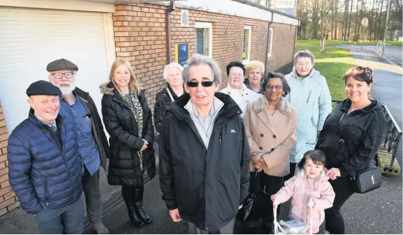  ??  ?? On the march Members of the community, community council, and elected members show a united front in their bid to takeover the community hall