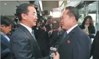  ?? YONHAP VIA REUTERS ?? Head of the DPRK delegation Ri Son-gwon shakes hands with his ROK counterpar­t Cho Myoung-gyon before their meeting at the truce village of Panmunjomo­n on Tuesday.