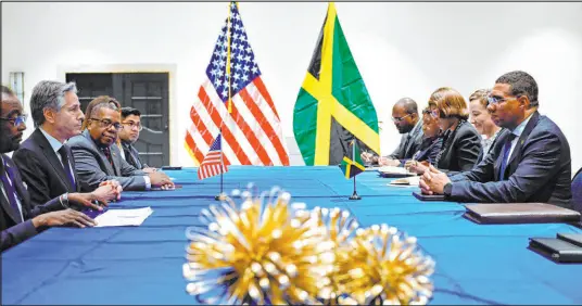  ?? Andrew Caballero-reynolds The Associated Press ?? Secretary of State Antony Blinken, second from left, meets Monday with Jamaican Prime Minister Andrew Holness, right, to discuss the violence in Haiti at the Conference of Heads of Government of the Caribbean Community in Kingston, Jamaica.