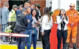  ??  ?? Family members of victims of a bombing gather outside the entrance to the General Santander police academy (Daily Mail)