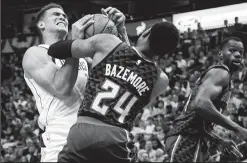  ?? SMILEY N. POOL/TRIBUNE NEWS SERVICE ?? The Dallas Mavericks' Dwight Powell (7) fights for a rebound against the Atlanta Hawks' Kent Bazemore (24) in Dallas on Wednesday.