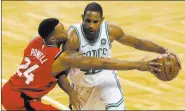  ?? Winslow Townson ?? Celtics forward Al Horford tries to get past Raptors forward Norman
Powell in the first quarter of Boston’s 95-94 win Sunday at TD Garden.
The Associated Press