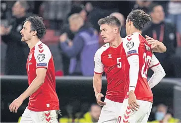  ?? AFP ?? Denmark’s Joakim Maehle, centre, celebrates his goal against Austria with Thomas Delaney, left, and Yussuf Poulsen.