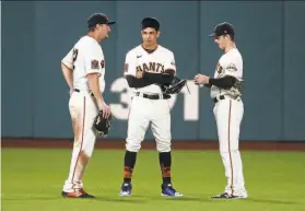  ?? Scott Strazzante / The Chronicle 2020 ?? Against righthande­d starters, the Giants could have an outfield of (from left) left fielder Alex Dickerson, center fielder Mauricio Dubón and right fielder Mike Yastrzemsk­i.