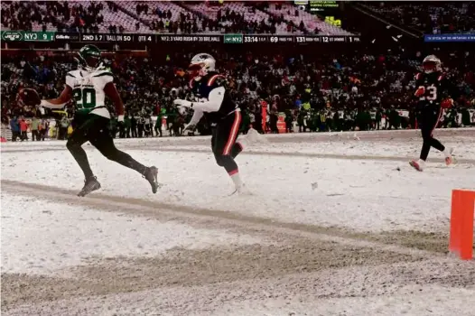  ?? MATTHEW J. LEE/GLOBE STAFF ?? The Jets’ Breece Hall beat Jeremiah Pharms Jr. to the end zone to finish off his game-sealing 50-yard touchdown run.