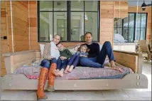  ??  ?? Scott and Morgan Lindsey, with their children, Beckett, 8, and Vivienne, 6, moved into their custom Dutch Cape home in 2018. Morgan, a designer, said she was diagnosed with breast cancer when they were designing the 4,300-square-foot home in Serenbe. The timing influenced many of her decisions, she said, about what the home would mean for her family’s lifelong wellness, including physically, socially and with a connection to nature.