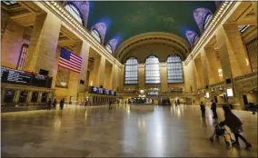  ?? FRANK FRANKLIN II ?? Commuters navigate through an empty Grand Central Terminal due to coronaviru­s concerns, Wednesday, April 29, 2020, in New York.