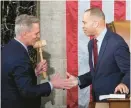  ?? ANDREW HARNIK/AP ?? Rep. Kevin McCarthy is given the speaker’s gavel by House Minority Leader Hakeem Jeffries early Saturday.