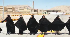  ?? Vahid Salemi / Associated Press 2005 ?? Iranian women formed a human chain in 2005 at the Isfahan Uranium Conversion Facility, in support of the nation’s nuclear program.