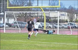  ?? Tim Godbee ?? The Calhoun goalkeeper makes a nice save in a recent game as sophomore defender Jacob Dupree closes in to help. The Yellow Jackets are 5-5 after their first 10 games and 1-1 in Region 7-5A action going into their Friday night contest at home against Cartersvil­le.