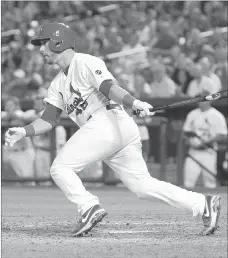  ?? JEFF CURRY/ USA TODAY ?? St. Louis Cardinals catcher Tony Cruz, giving regular starter Yadier Molina a night off, pulls his tie-breaking two-run double past third base in the seventh inning of a 10-9 victory over the Chicago Cubs on Monday night.