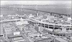 ?? Associated Press ?? THE DECISION to rid the city of the double-decker Embarcader­o Freeway, above in 1957, prompted a reenvision­ing of the area.
