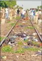  ??  ?? Police personnel inspect the spot after a goods train ran over a group of migrant workers while they were sleeping on the tracks, in Aurangabad district, on Friday