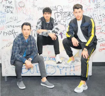  ?? Photo / Getty Images ?? Kevin, Joe and Nick Jonas, the Jonas Brothers, have a new album coming out.