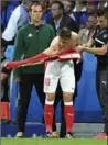  ?? GEERT VANDEN WIJNGAERT, THE ASSOCIATED PRESS ?? Switzerlan­d’s Granit Xhaka puts on a new shirt Sunday against France.