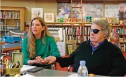  ??  ?? Glass artist Dale Chihuly, right, holds the arm of his wife Leslie as they talk in his private studio in Seattle.