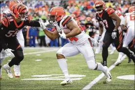  ?? ANDY LYONS / GETTY IMAGES ?? Browns running back Nick Chubb ran for 41 yards Sunday in his bid to claim the NFL’s rushing title. Chubb finished the season with 1,494 yards and eight touchdowns but he didn’t top 50 yards in either of his final two games.