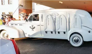  ??  ?? Hearse: Aretha’s casket is carried into the church from the vehicle that was used for the funeral of civil rights activist Rosa Parks