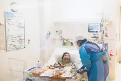  ?? Nic coury / Special to The chronicle ?? Nurse Cassie Barber tends to Carmelita Martinez at a COVID unit at Salinas Valley Memorial Hospital in January.