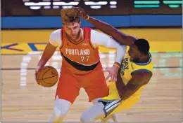  ?? JOSE CARLOS FAJARDO — BAY AREA NEWS GROUP ?? Portland’s Jusuf Nurkic is called for an offensive foul against the Warriors’ Draymond Green during a game on Sunday.