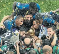  ?? ADRIAN DENNIS/AFP/GETTY IMAGES ?? France won the World Cup for the second time with a deep lineup studded with high-end talent, in a tournament where countries that relied on a single superstar fell by the wayside. It’s a lesson with ramificati­ons for emerging Canadian star Alphonso Davies, left.