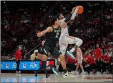  ?? RICK BOWMER — THE ASSOCIATED PRESS ?? Colorado guard KJ Simpson ( 2) defends against Utah guard Deivon Smith Saturday in Salt Lake City.