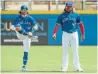  ?? STEVE NESIUS THE CANADIAN PRESS ?? Bo Bichette, left, and Vladimir Guerrero Jr. loosen up before a spring training game Tuesday.