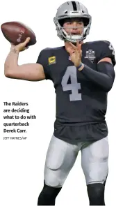  ?? JEFF HAYNES/AP ?? The Raiders are deciding what to do with quarterbac­k Derek Carr.
