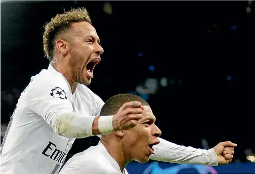  ?? AP ?? Neymar, left, and team-mate Kylian Mbappe celebrate PSG’s second goal in their 2-1 win over Liverpool in Paris.