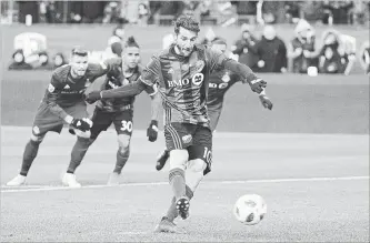  ?? GRAHAM HUGHES THE CANADIAN PRESS ?? Montreal Impact's Ignacio Piatti scores on a penalty shot.