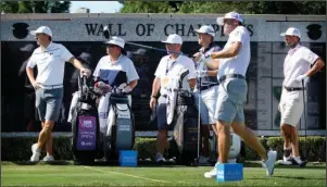  ?? The Associated Press ?? GOLF RETURNS: Jordan Spieth, left, watches Ryan Palmer tee off the first hole during practice for the Charles Schwab Challenge golf tournament at the Colonial Country Club in Fort Worth, Texas, Tuesday. The Challenge is the first PGA tour event since the COVID-19 pandemic began.