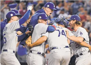  ?? MATT KARTOZIAN, USA TODAY SPORTS ?? The Dodgers celebrate their win Monday that advanced them to the NL Championsh­ip Series.
