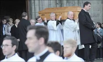  ??  ?? The remains of the late Most Rev. Gerard Clifford, DD, Auxiliary Bishop Emeritus to the Archbishop of Armagh being carried from St. Patrick’s Church following Requiem Mass on Thursday afternoon.