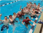  ?? Dave Stewart/Hearst Connecticu­t Media ?? The Greenwich boys swimming and diving team celebrate with coach Terry Lowe in Yale’s Kiphuth Pool after winning the 2023 CIAC State Open on Saturday.