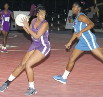  ?? (Photo: Observer file) ?? St Ann Orchids’ Patricia Mccalla (left) collects ball ahead of Clarendon Gators’ Monique Emery during their Berger Elite League game at the Leila Robinson Courts last month.