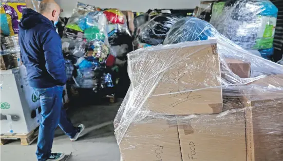  ?? ?? Boxes of goods at the Benfica parish council, Lisbon, ready to be transporte­d to Ukraine and neighbouri­ng countries